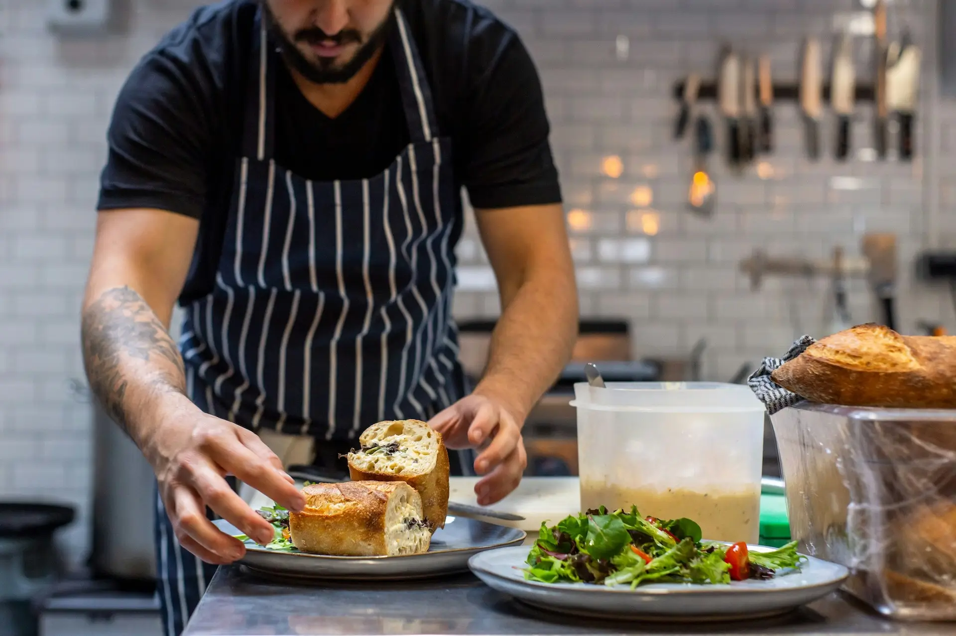 a caterer preparing food putting it on plates