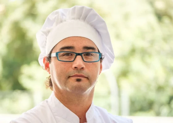 image of a chef wearing a chef's hat and glasses