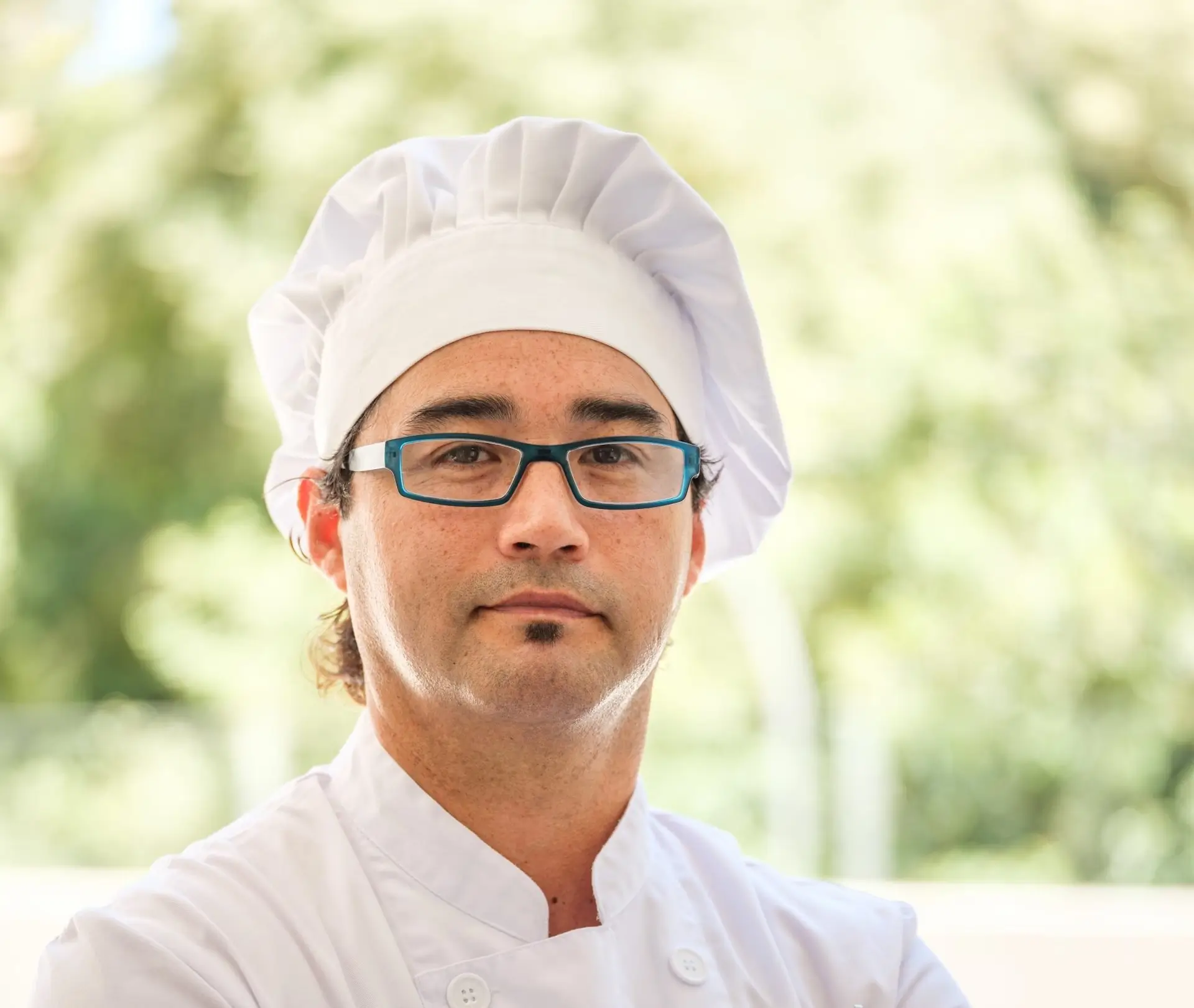 image of a chef wearing a chef's hat and glasses