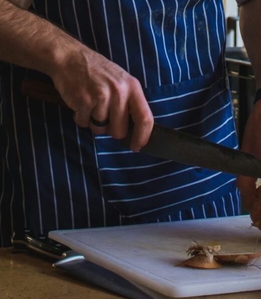 a chef chopping veg while catering for complex needs in care homes