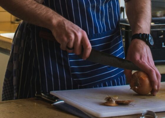 a chef chopping veg while catering for complex needs in care homes