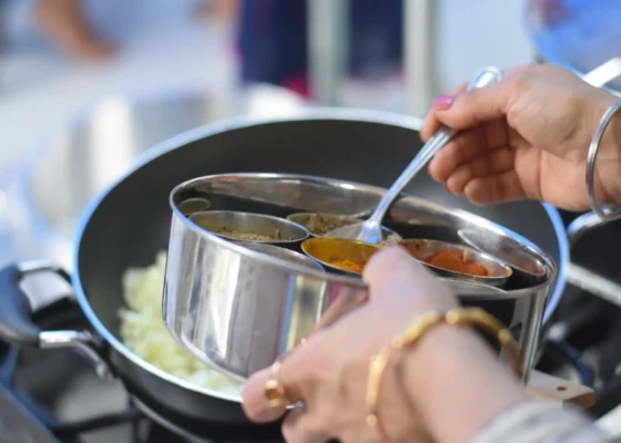 a chef over a pot of sauce recruited for catering jobs