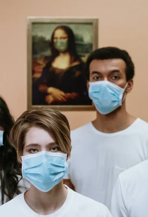 a group of individuals wearing PPE masks