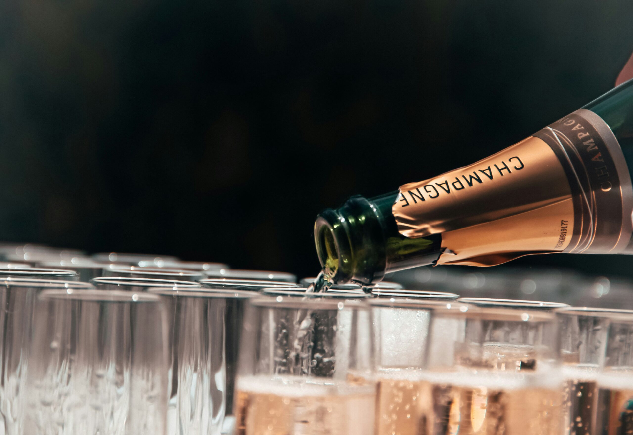 event catering staff pouring champagne